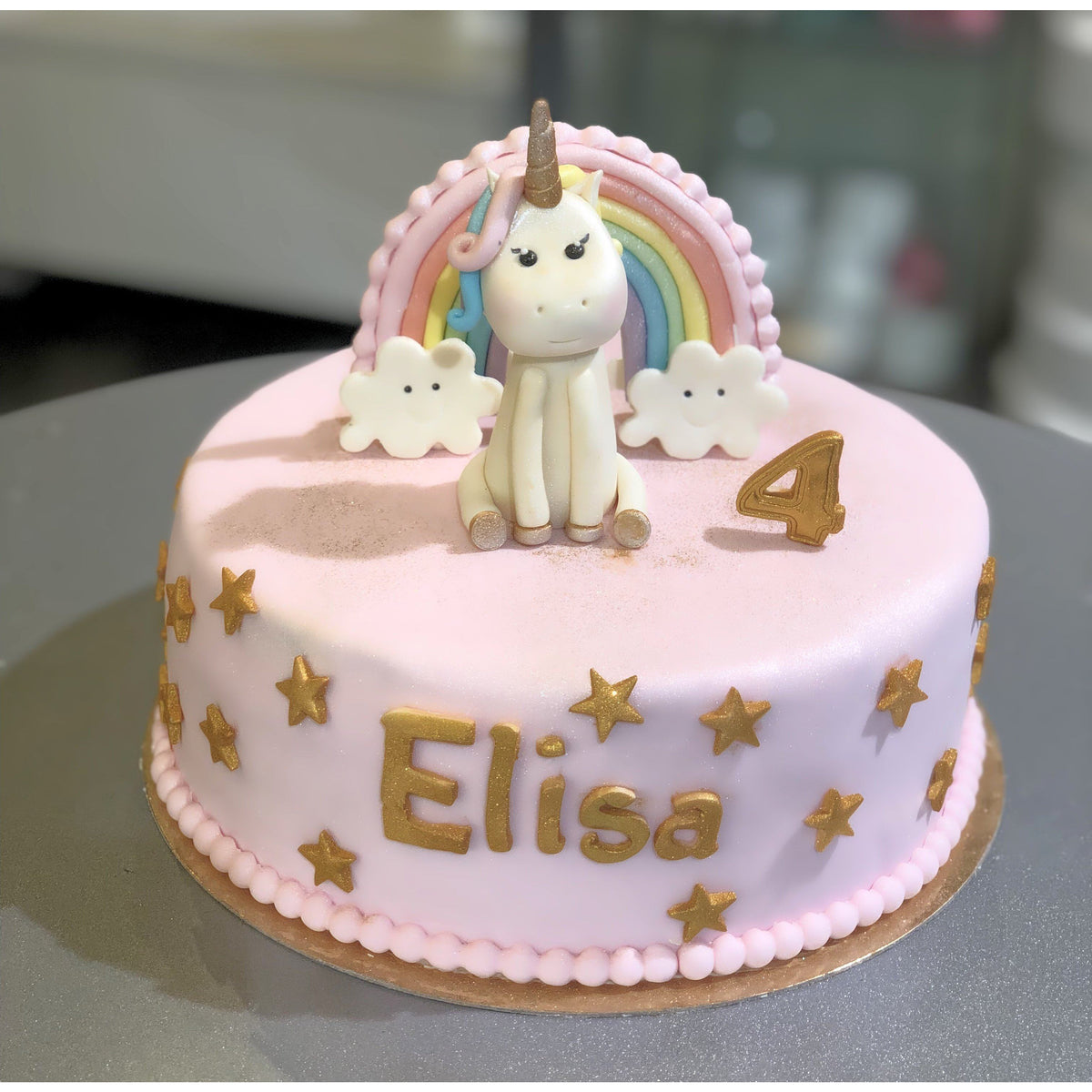 GÂTEAU LICORNE ROSE ET DORÉ - L'Atelier des Gâteaux